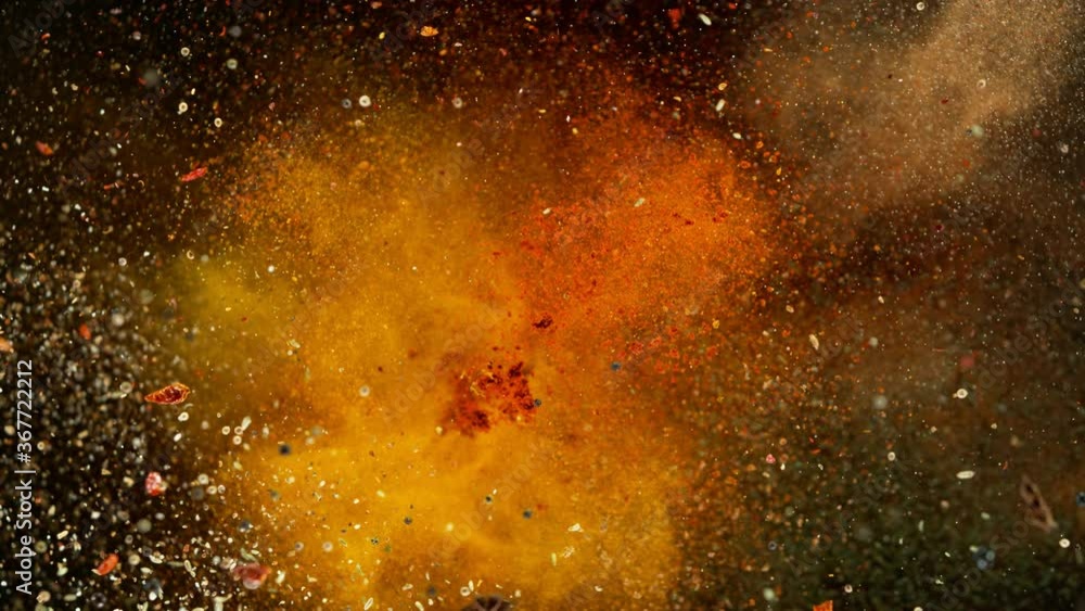 Super slow motion of flying spices mix with ramp speed motion. Filmed on high speed cinema camera, 1000 fps Super slow motion of flying spices mix with ramp speed motion. Filmed on high speed cinema camera, 1000 fps