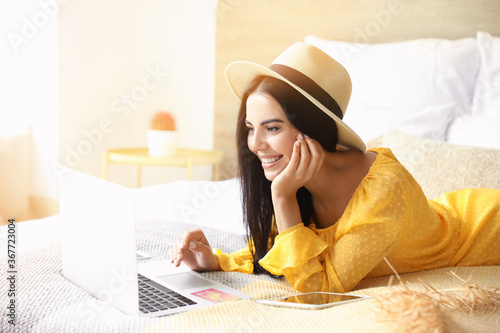 Woman with laptop booking t...