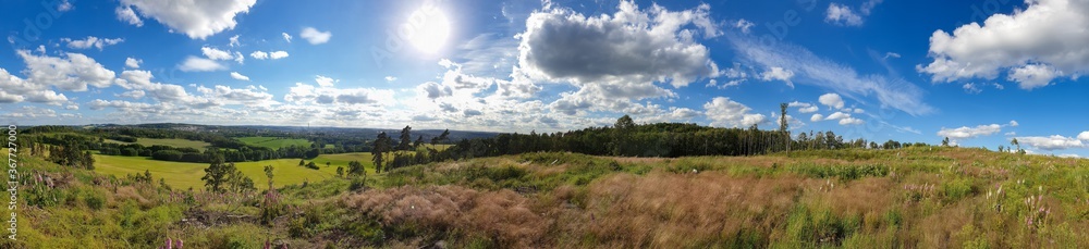 scenic panorama view of natural landscape under a cloudy sky scenic panorama view of natural landscape under a cloudy sky