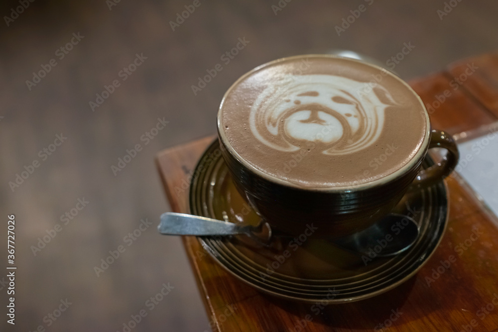 Cute animal bear face latte or Cocoa art in brown cup on wood table. Cute animal bear face latte or Cocoa art in brown cup on wood table.