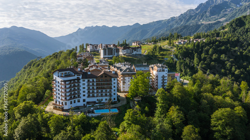 Rosa Khutor plateau, buildings, slopes and chair lifts. Aerial view at summer. Russia, Sochi, Krasnaya Polyana photo