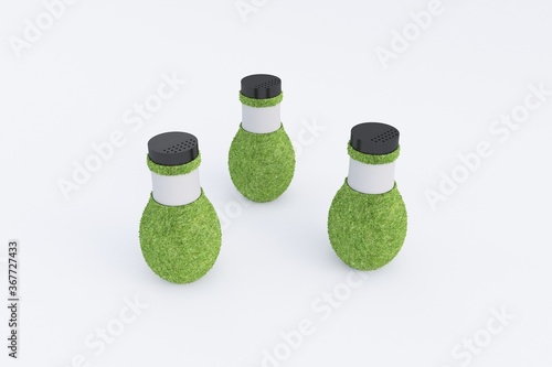 3 Bottles covered with grass photo