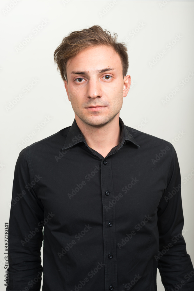 Obraz premium Portrait of businessman with blond hair looking at camera