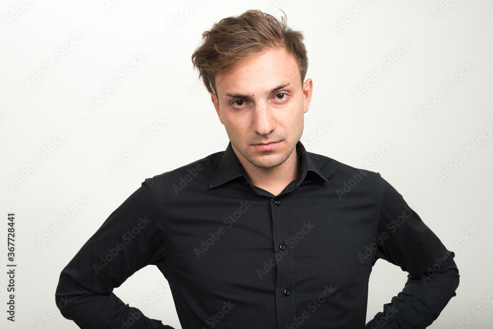 Portrait of businessman with blond hair looking at camera Portrait of businessman with blond hair looking at camera