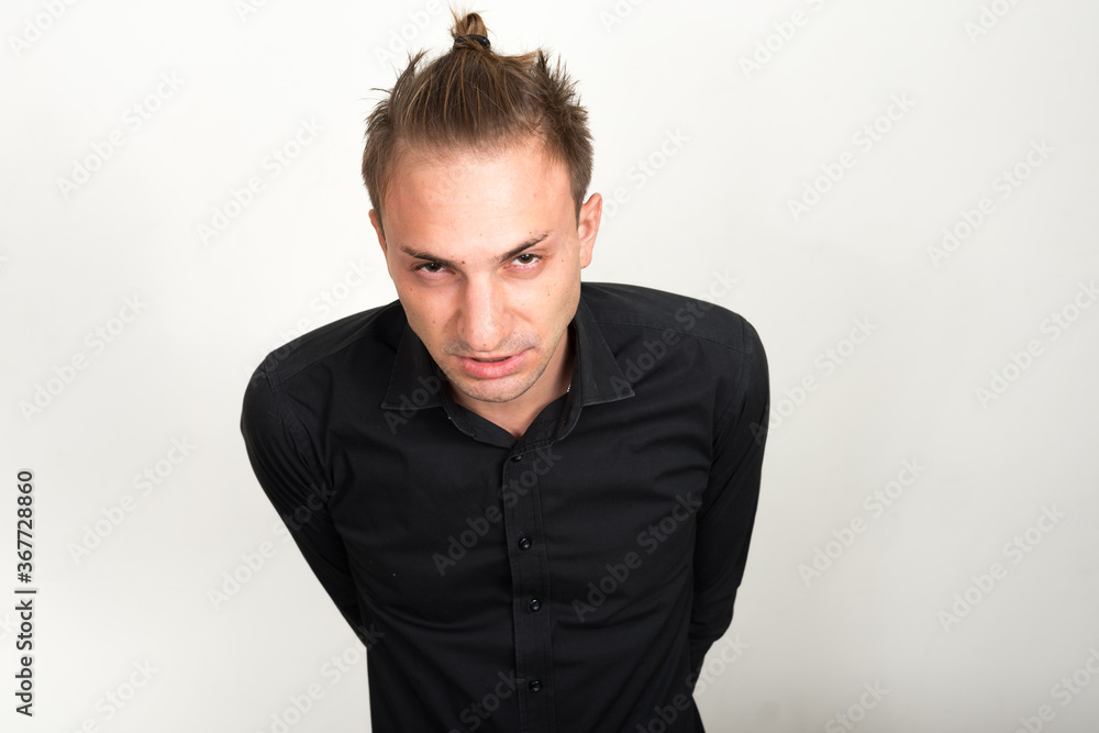 Fototapeta premium Portrait of stressed businessman with blond hair looking angry