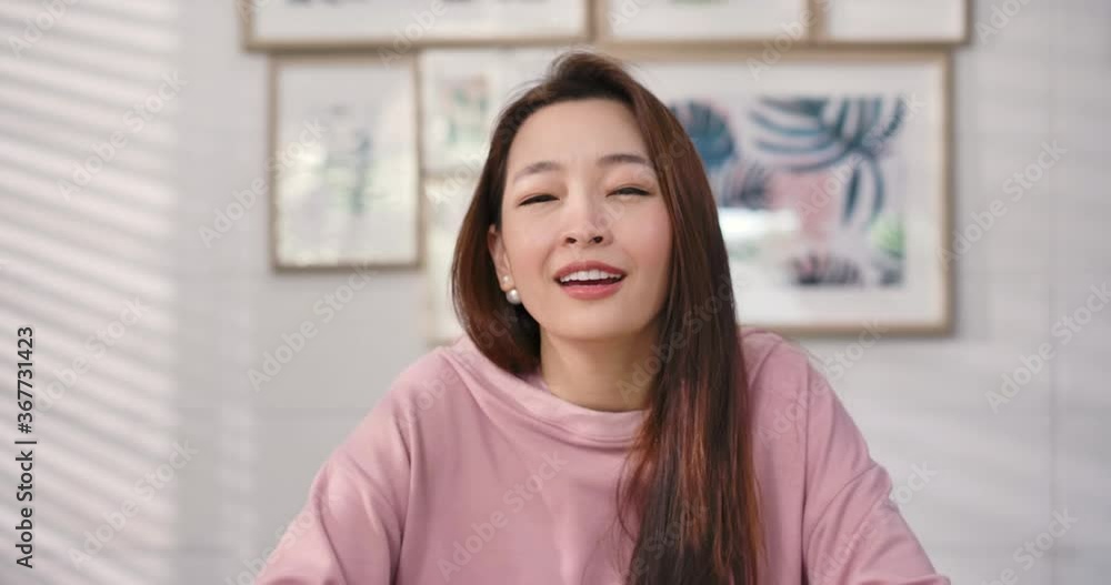 Close up portrait of attractive young asian female making videocall or vlog. Happy woman talking and laughing looking at web cam during communicate in online chat. webcam view, videochat concept. Close up portrait of attractive young asian female making videocall or vlog. Happy woman talking and laughing looking at web cam during communicate in online chat. webcam view, videochat concept.