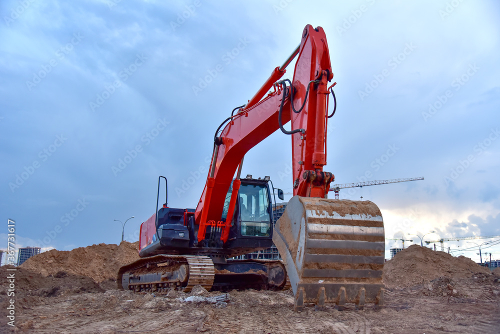 Excavator on eartwork working at construction site. Excavator on eartwork working at construction site.