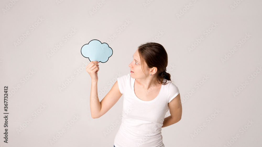 Surprised happy woman in shirt holding blank speech bubble Surprised happy woman in shirt holding blank speech bubble