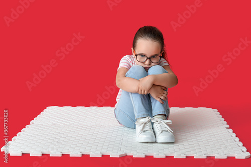 Sad little girl with autist...