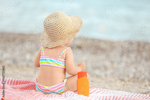 Cute baby girl with sunscre...