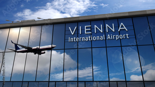 Airplane landing at Vienna Austria airport mirrored in terminal