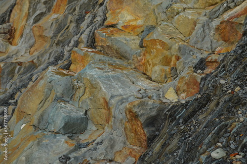 Rock layers - a colorful formations of rocks stacked over the hundreds of years. Interesting background with fascinating texture.