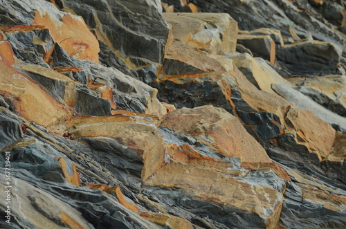 Rock layers - a colorful formations of rocks stacked over the hundreds of years. Interesting background with fascinating texture.