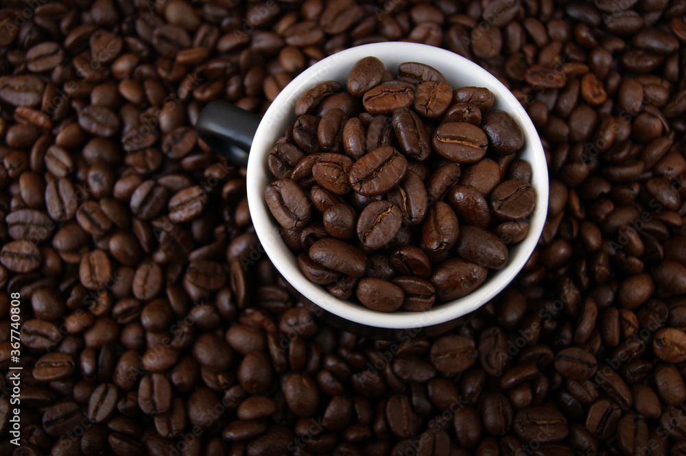 A cup filled with coffee grains. A cup filled with coffee grains.