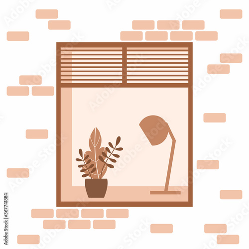 A street window with a lamp and a flower on the sill.
