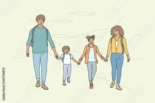 Sport, recreation, activity, camping, hiking fatherhood, motherhood, childhood concept. Young happy african american family man dad woman mom children kids son and daughter walking together in nature.