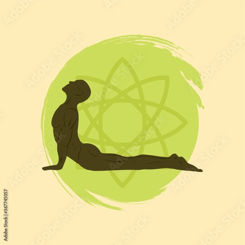 man practicing yoga in sphinx pose