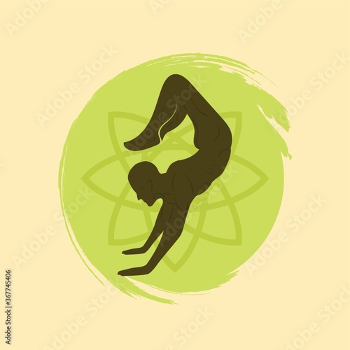 man practicing yoga in scorpion pose