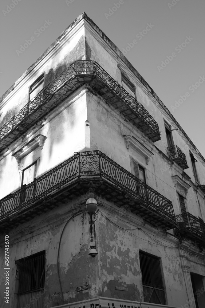 Beautiful close up of an old and authentic historical building  in white and black, monochrome, with details, cuban architecture, Havana, Cuba. 