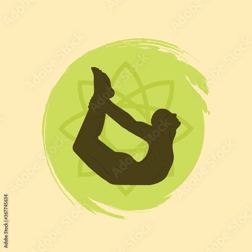 man practicing yoga in bow pose