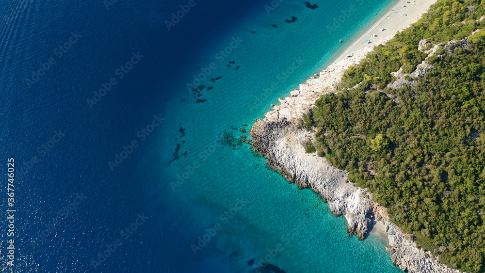 Obraz premium Aerial drone panoramic photo of famous turquoise paradise beach of Milia covered with pine trees, Skopelos island, Sporades, Greece