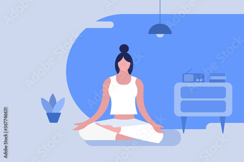 A girl sitting in lotus pose doing meditation inside the room