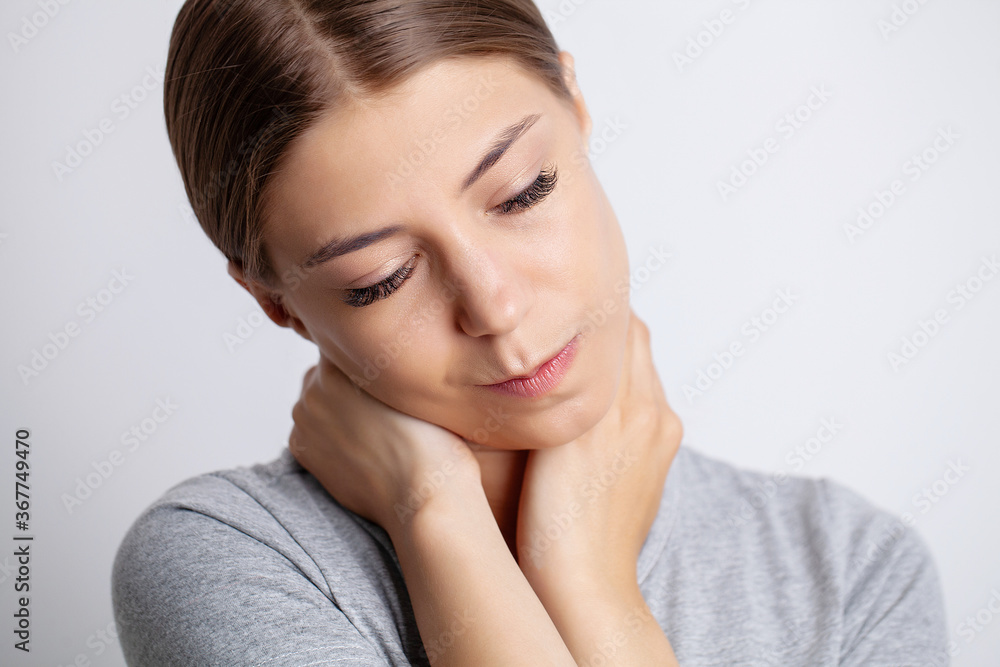 Young woman is experiencing severe neck pain Young woman is experiencing severe neck pain