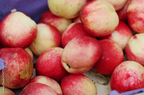 Juicy nectarines on the market close up