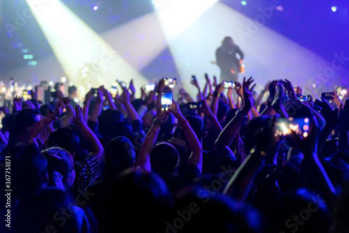 blur of People shooting video or photo in music brand showing on stage or Concert Live, party concept