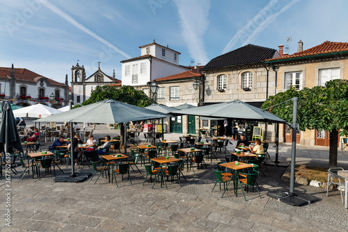 Historic center square of beautiful Caminha with Cafe. photo