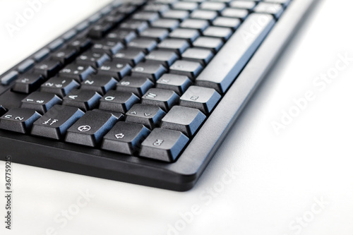 computer keyboard on white background, close-up, macro