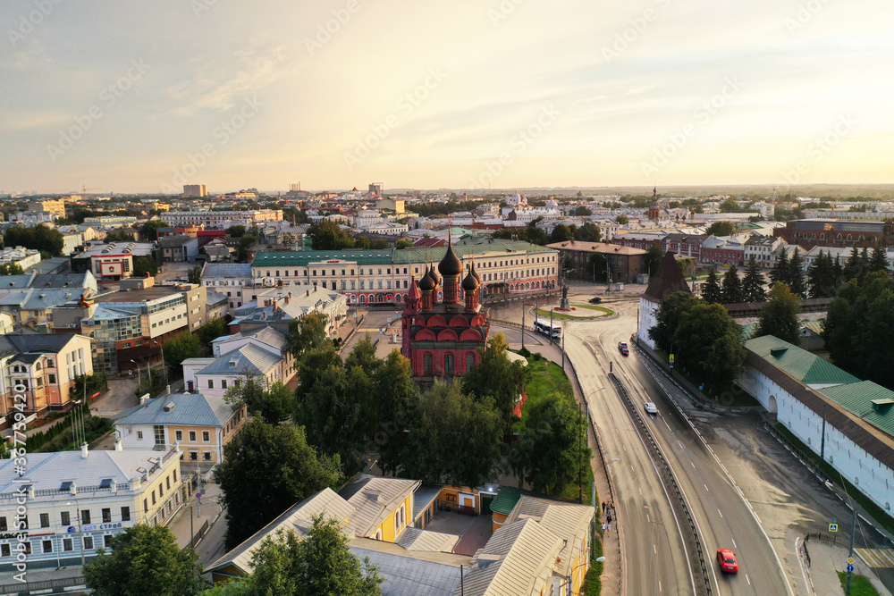 Fototapeta premium a panoramic view of the old fortress and church in the early morning at dawn filmed from a drone