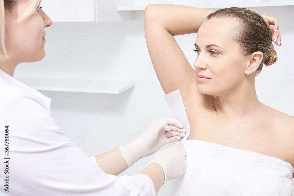 Hot hair removal depilation. Female skin routine. Sugar bodycare. Wax correction. Professional cosmetologist help girl. Sugaring bodycare cosmetics. Armpit service Hot hair removal depilation. Female skin routine. Sugar bodycare. Wax correction. Professional cosmetologist help girl. Sugaring bodycare cosmetics. Armpit service