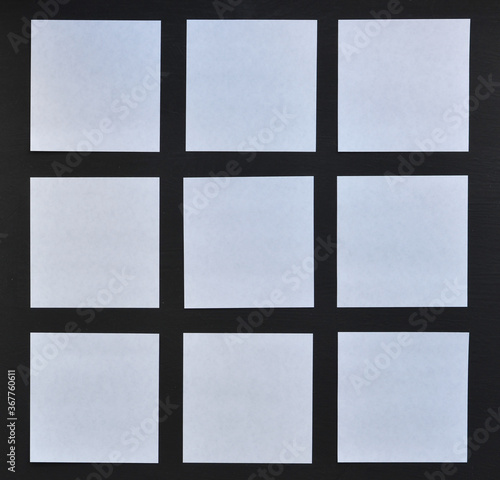 White quadraut sheets on a black background