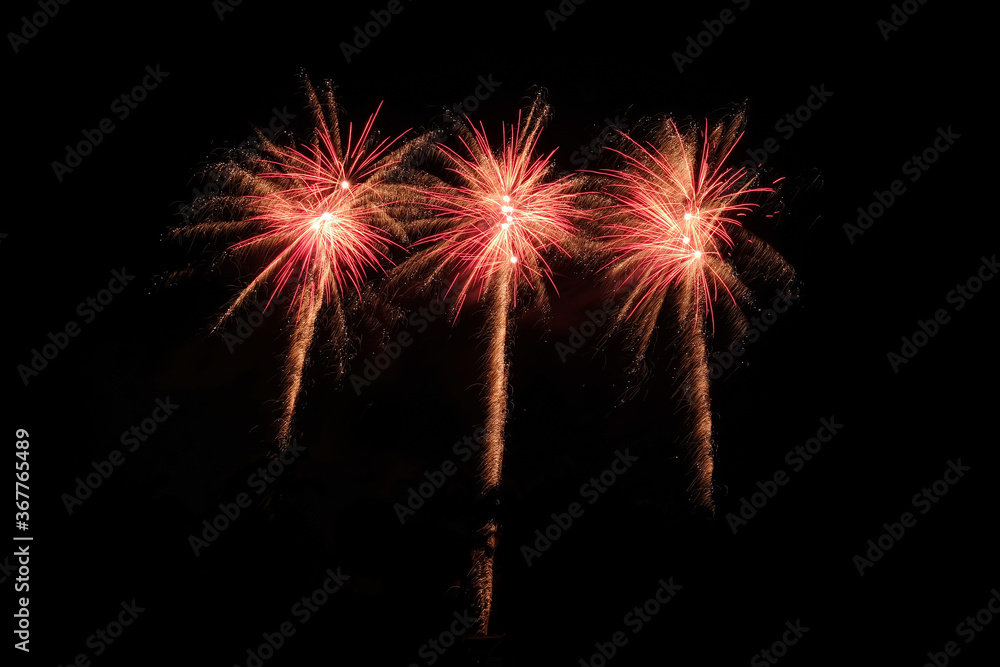 Colourful fireworks explosion displays on black background, isolated pattern design, asset for compostion