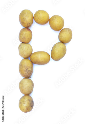 Letter P of the English alphabet from potatoes. A letter made of fruit on a white background.