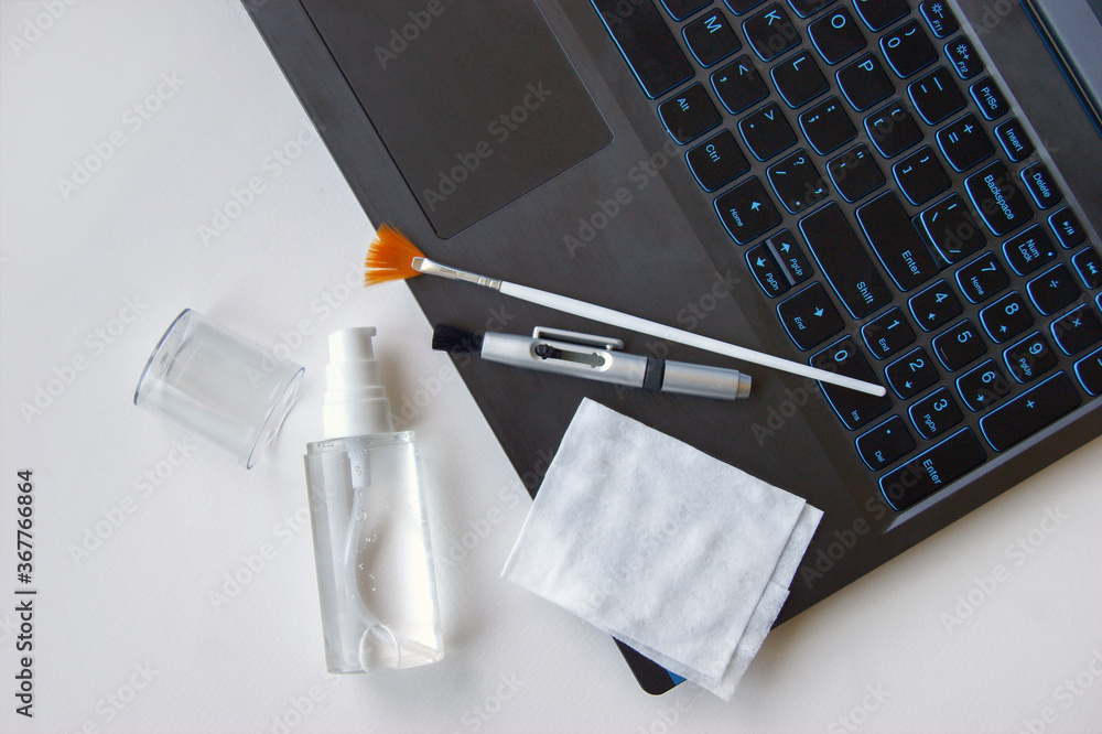 Keyboard, napkin, antiseptic and brushes on a white background.