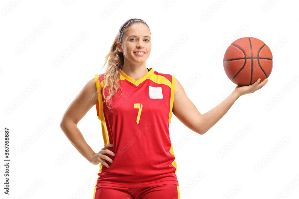 Female basketball player posing with a ball Female basketball player posing with a ball