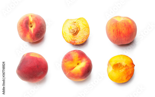 Many ripe peaches on light background