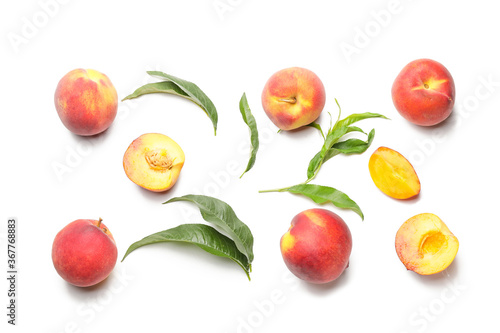 Many ripe peaches on light background