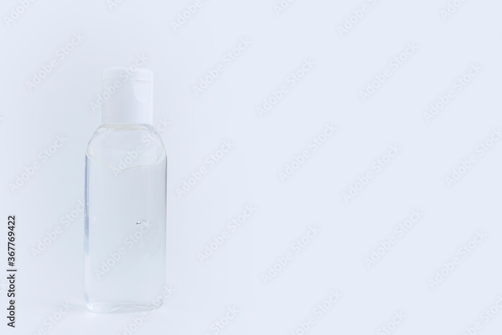 Bottle of instant antiseptic hand sanitizer transparent gel isolated on gray white background, no label. Antibacterial, hydro alcoholic gel, ethyl alcohol. Mini travel pocket small size. Banner. Bottle of instant antiseptic hand sanitizer transparent gel isolated on gray white background, no label. Antibacterial, hydro alcoholic gel, ethyl alcohol. Mini travel pocket small size. Banner.