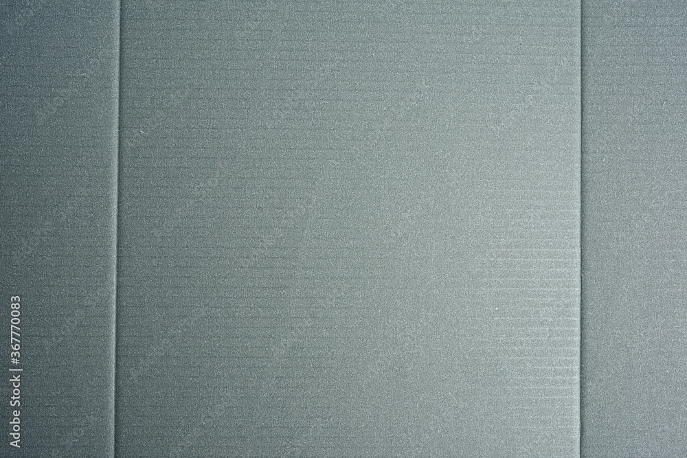 Fototapeta premium gray cardboard texture with folds, full frame