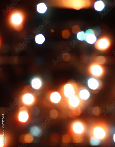 Blurred bokeh in warm colors. Lights and highlights for the background. © OLGA RA