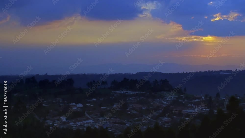 beautiful timelapse from sunset to night in the Salento valley where we can see the small houses and how the blue clouds give way to darkness beautiful timelapse from sunset to night in the Salento valley where we can see the small houses and how the blue clouds give way to darkness