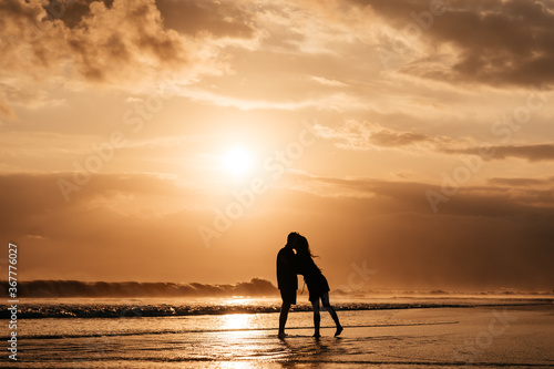 Young couple in love, Attractive man and woman enjoying romantic evening on sunset