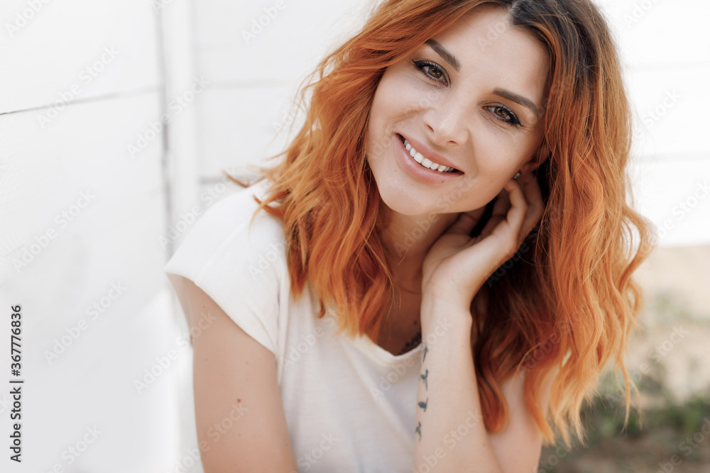 Portrait of a young smiling happy ginger woman outdoor Portrait of a young smiling happy ginger woman outdoor