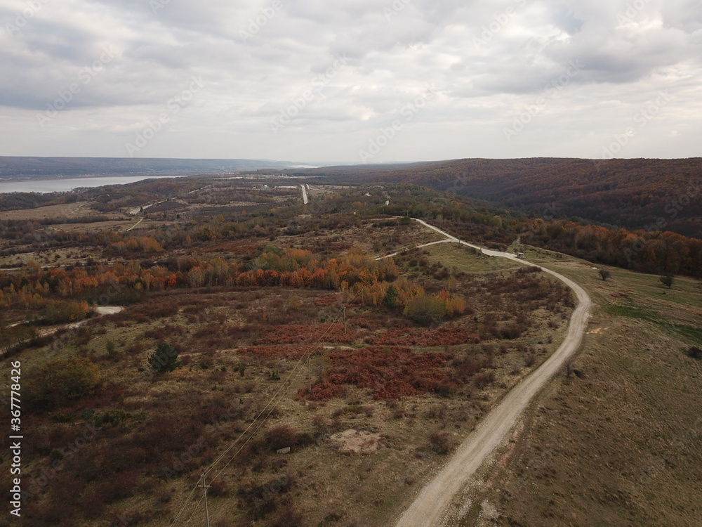 country roads seen from above. autumn landscape with forests and meadows seen from the drone