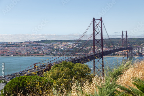 Bridge on April 25 in Lisbon on the Tejo river with moving cars. © sytnik