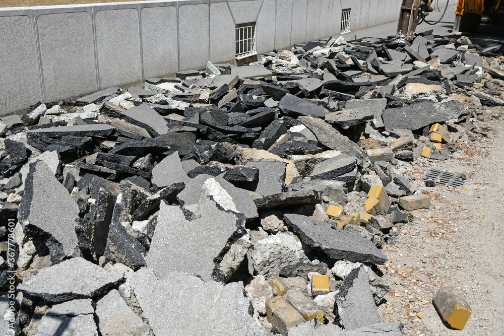 Fototapeta premium Braking the asphalt at the road construction