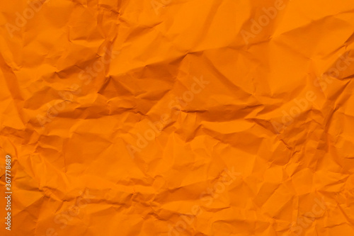 crumpled orange paper for orange background